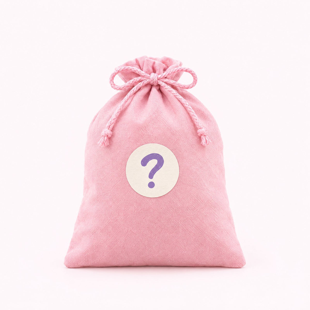 A pink gift bag with a question mark sticker, a mystery mofu inside