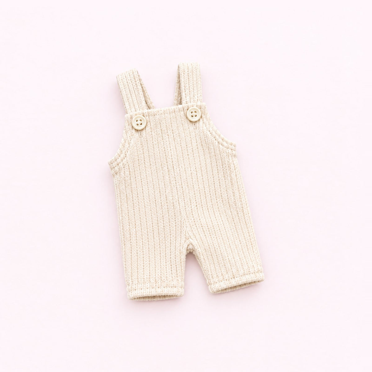 The cream ribbed overalls with two tiny buttons