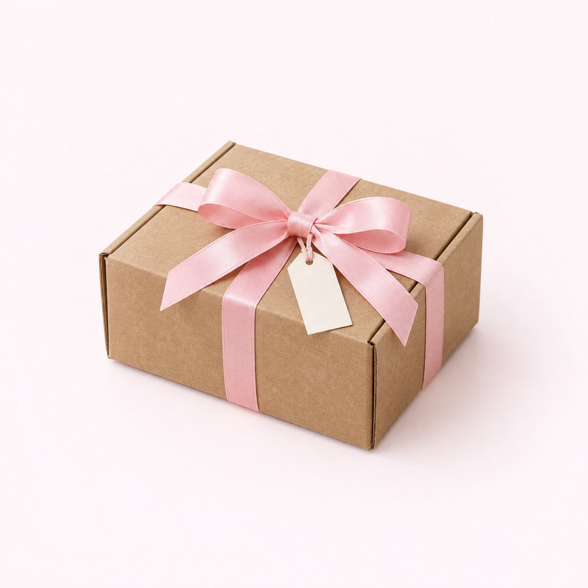 A kraft parcel tied with a pink ribbon